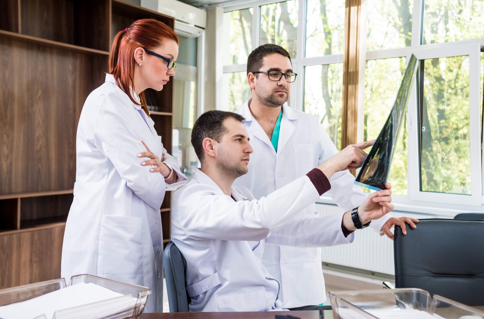 Doctors Team Having Medical Council In Hospital. Discussing Medi